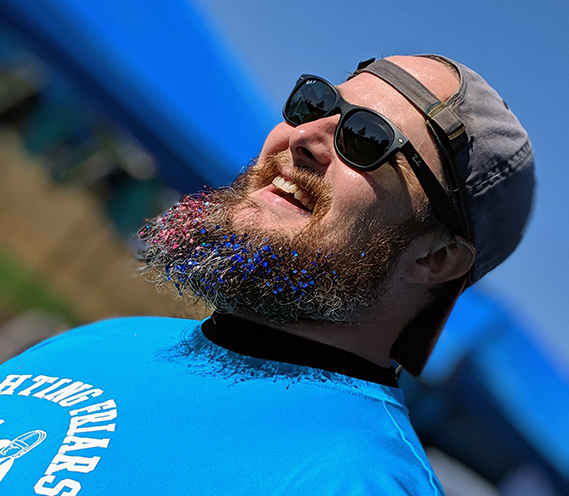 student dyed beard blue and red for sports