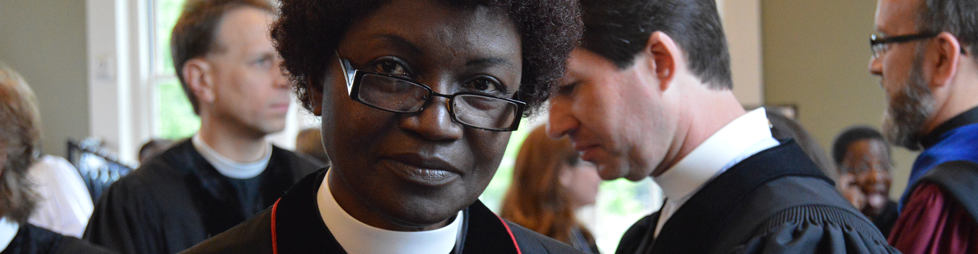 Woman with glasses looking at the camera